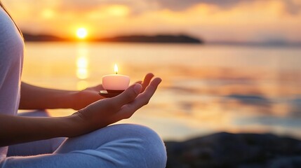Aufkleber - Woman meditates at sunset, holding a lit candle in her hands, peaceful ocean view in the background. Serene moment of contemplation and inner peace. : Generative AI