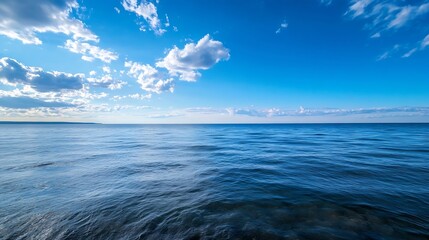 Aufkleber - Serene ocean landscape with a clear blue sky and fluffy white clouds, showcasing a tranquil and peaceful seascape under a bright sunny day. : Generative AI