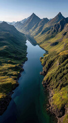 Poster - Aerial view of a serene, long lake nestled between majestic, verdant mountains under a clear, bright sky. The tranquil water reflects the surrounding peaks, creating a breathtaking natural landscape.