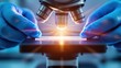 © Imam - Close-up shot of microscope with metal lens at laboratory.