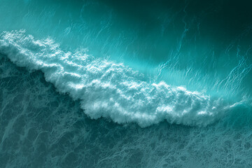 Poster - aerial view of turquoise ocean wave, white foam cresting, creating a dynamic texture, symbolizing po