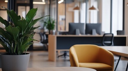 Aufkleber - A vibrant green peace lily plant in a gray pot sits on a light wood table in a modern office setting, with blurred background of desks, chairs, and computers. : Generative AI