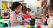 © peopleimages.com - Education, kids and girls in painting class for art, creative talent and motor skill development in preschool. Learning, students drawing and children with color for artwork and sketch with brush