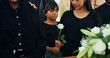 © peopleimages.com - Loss, death or child with flower in funeral farewell service, mourning person or grief. Coffin, goodbye or girl grieving with sorrow or respect in cathedral for burial, religion and memorial ceremony