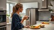 © Naksit - A young woman thoughtfully enjoys a healthy meal of fruits and vegetables in her modern kitchen at night.