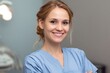 © marimalina - Smiling healthcare professional in scrubs ready for patient care in a modern clinic environment