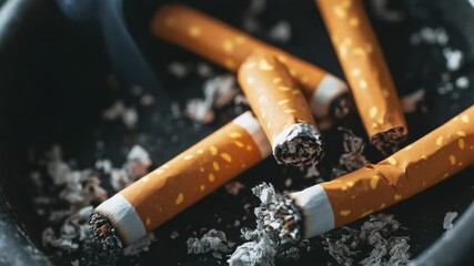 Poster - A close-up view of cigarettes placed in an ashtray, ideal for use in images related to smoking habits, addiction, or cultural context