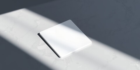 Poster - A minimalist composition featuring a white square tile illuminated by soft light and shadows on a surface