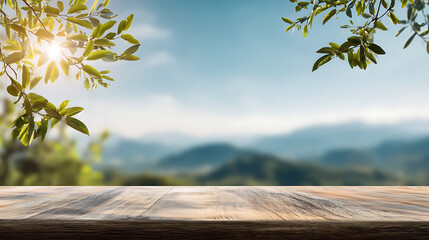 Poster - Table background of free space for your decoration and blurred landscape of mountains, blue sky with sun light and green small leaves