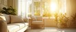 © NoLapan - Sunlight Streams Through A Large Window Into A Living Room, Illuminating Beige Couches And Potted Plants.  It'S A Calm, Serene Scene.