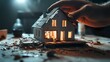 © THUA - A symbolic image of a small house model torn apart by hands, with visible cracks and scattered parts, highlighting the struggles of property division during separation