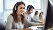 © SOEM - A smiling customer service representative wearing a headset, working at a desk in a call center.