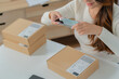 © mojo_cp - Small business owner preparing parcel for delivery online selling sell Online on the Internet from home