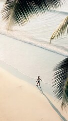 Aufkleber - Aerial view of woman walking barefoot on sandy tropical beach, silhouetted against sunset with palm trees lining shoreline, experiencing serene coastal moment