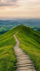 Poster - Wooden planks create a winding path leading up a vibrant green mountainside, offering a picturesque hiking trail amidst a breathtaking natural landscape at sunset