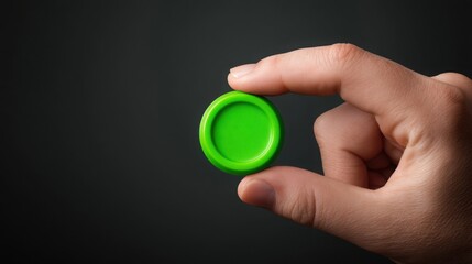 Poster - A person holding a green button symbolizing passive trigger icon concept representing action from inaction realism
