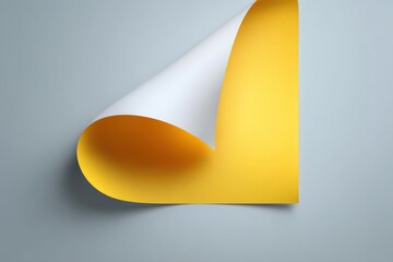 Poster - An eye-level close-up of a vibrant yellow sheet of paper with a curled white corner, casting a gentle shadow on a light gray background creating a modern and minimalist composition.