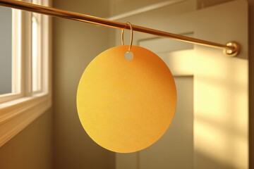 Poster - Elegant golden tag hanging on a golden rail with a window and a neutral background, offering space for promotional messages and eye-catching product visibility.