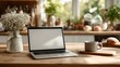 © Firadoaw - Simple and clean workspace: open laptop with blank screen on wooden table in kitchen home office