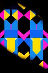 Poster - Vibrant geometric pattern in blue, yellow, and pink on black background