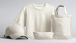 © Екатерина Чумаченко - A set of blank apparel items: t-shirt, cap, tote bag, and pouch, arranged on a neutral background.