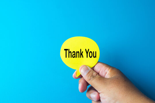 A image showing a hand holding a yellow 