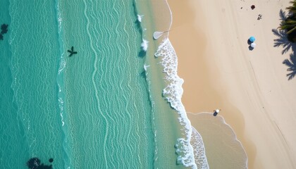  Aerial View of Clear Blue Ocean Waves Gently Lapping Against a Sandy Beach in a Tropical Paradise
