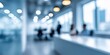 © Iryna - A blurry image of a business meeting room with people sitting at desks and a counter. The room is dimly lit and the people are wearing suits. Scene is professional and serious