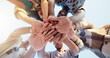 © peopleimages.com - Hands stack, low angle and group of friends outdoor with community, collaboration or support. Circle, bonding and people with palms together for solidarity, goals or target in huddle from below.