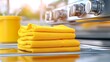 © armaya - Stack of yellow clothes on outdoor grill
