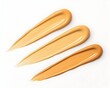 © Mohan - Three swatches of foundation showcasing varying shades of beige and tan
