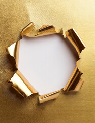 Poster - Torn golden paper with a white hole in the center. Shiny, metallic texture with jagged edges, revealing a blank space for text or image.