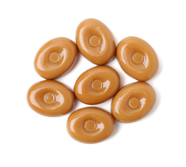 Wall Mural - Tasty hard toffee candies isolated on white, top view