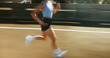 © peopleimages.com - Motion blur, fitness and body of woman running on bridge in city for race, marathon or training. Sports, speed and female athlete on highway with cardio workout, challenge or exercise in town.