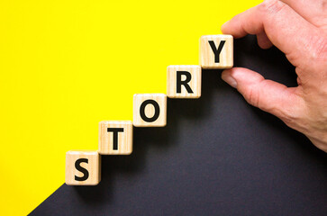 Fototapete - Story symbol. Concept word Story on beautiful wooden blocks. Beautiful yellow and black background. Businessman hand. Business lifestyle story concept. Copy space.