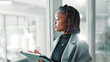 © peopleimages.com - Black woman, business and thinking with tablet for idea, brainstorming or networking. Opportunist, person and tech for problem solving notes, research and reflection by glass or space for future
