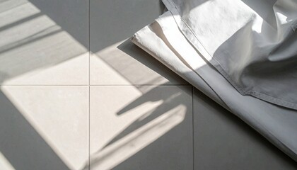 Poster - Natural light play on textured tiles modern interior space abstract photography minimalist design high angle view interior aesthetics