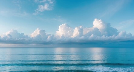 Wall Mural - scenic beach view at sunrise with clear horizon and cloudy sky