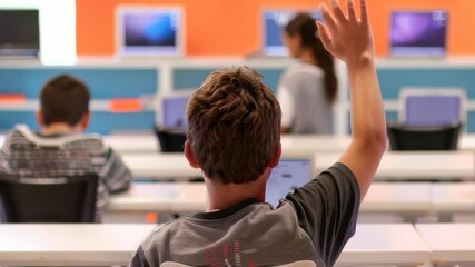 Poster - In a bright classroom, a student raises his hand. The setting includes computers and other students, suggesting a modern learning environment focused on technology and interactive participation.