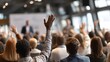 © Mitchell - Audience Participation Diverse People Hands Raised Conference Meeting Active Q A Session Engaged Attendees Business Seminar Group Discussion