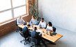 © Prostock-studio - Teamwork Concept. Diverse Colleagues Working Sitting Together At One Desk In Modern Office. High Angle Shot