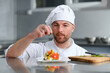 © Serhii - Professional Chef Working in a Famous Restaurant Kitchen