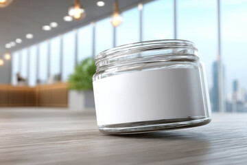 Poster - A clear glass jar with a blank white label sits on a wooden surface, illuminated by soft lights in a modern office setting with large windows and city views.