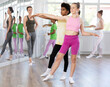 © JackF - Gracious teen girl doing choreography in pair with boy during ballet classes in dance studio