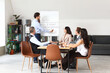 © Pixel-Shot - Male lawyer near flipchart and colleagues working in office