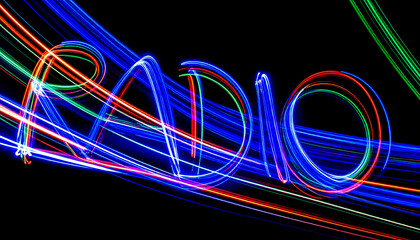 Poster - Radiant Light Waves Forming the Word RADIO Against a Dark Background