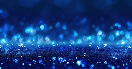 Abstract blue bokeh lights with shimmering effect.