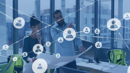 Poster - Two male colleagues working on architectural blueprint in office, showing floating network icons
