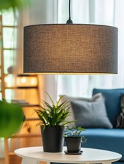 Poster - Interior view of a living room with a modern lamp and plants on a table in a cozy home setting