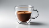 Isolated half glass of espresso coffee with levitation effect on background